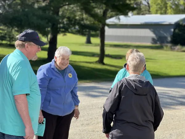 Church members talking together outdoors